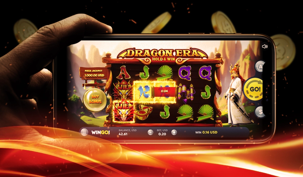 Hand holding a phone. On the screen is the “Dragon Era” online pokie game with letters, dragons and characters.